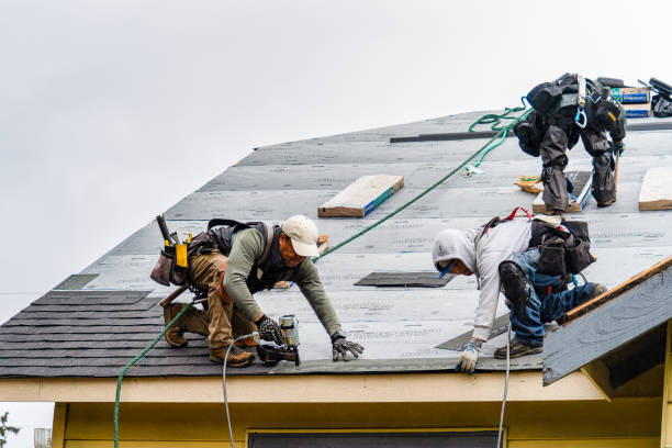 Professional Gutter Installation technician working in Bellefontaine, MS